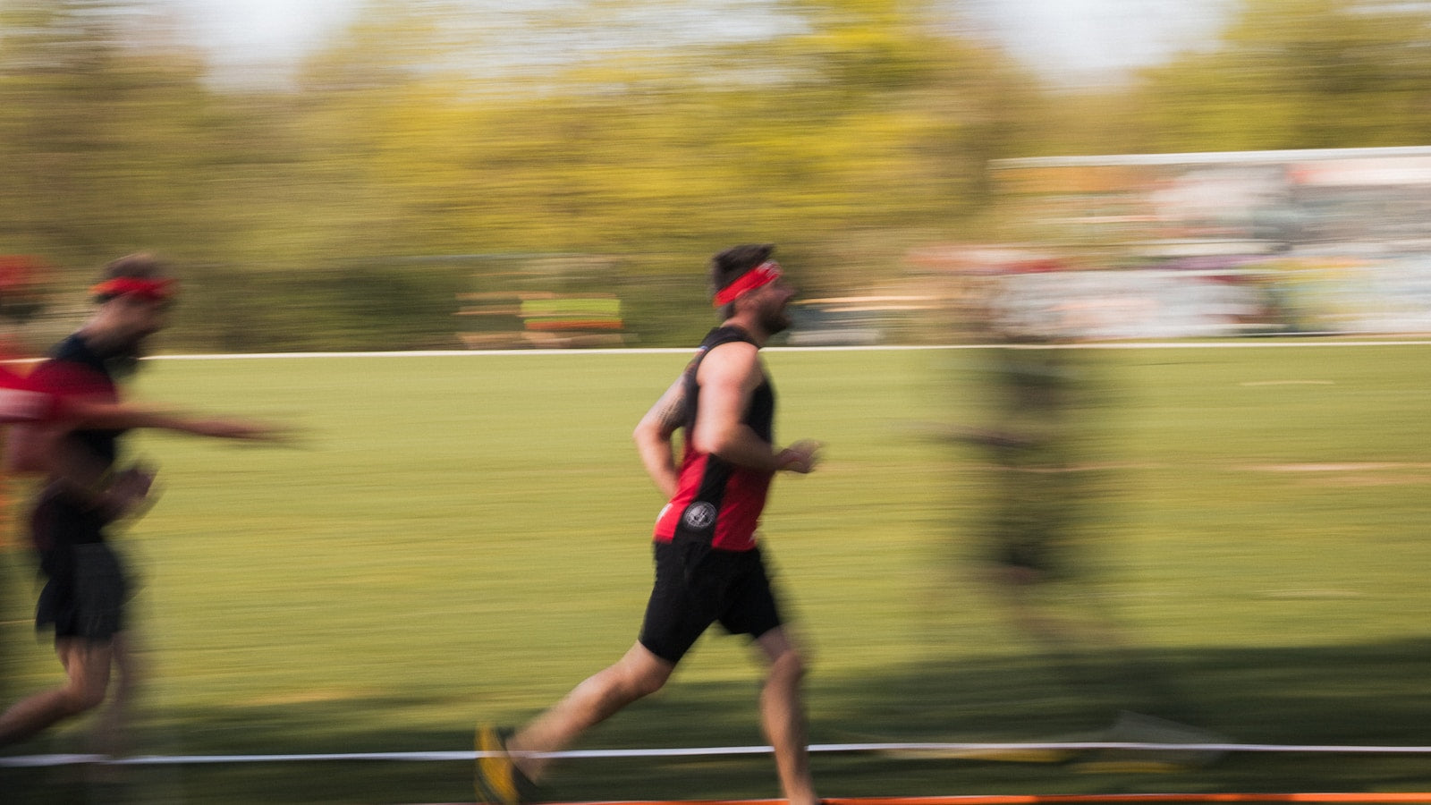 Runners moving at speed during an outdoor race